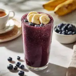 acai blueberry smoothie in a tall glass