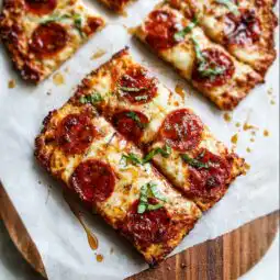 High protein chicken pizza crust sliced and served