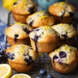 blueberry poppy seed lemon muffins on cooling rack
