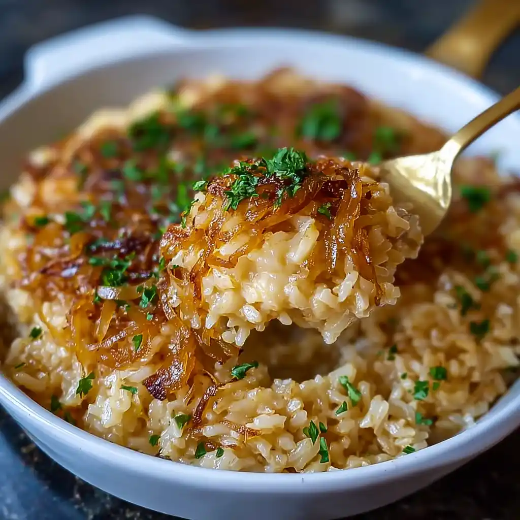 French onion rice served in a rustic bowl