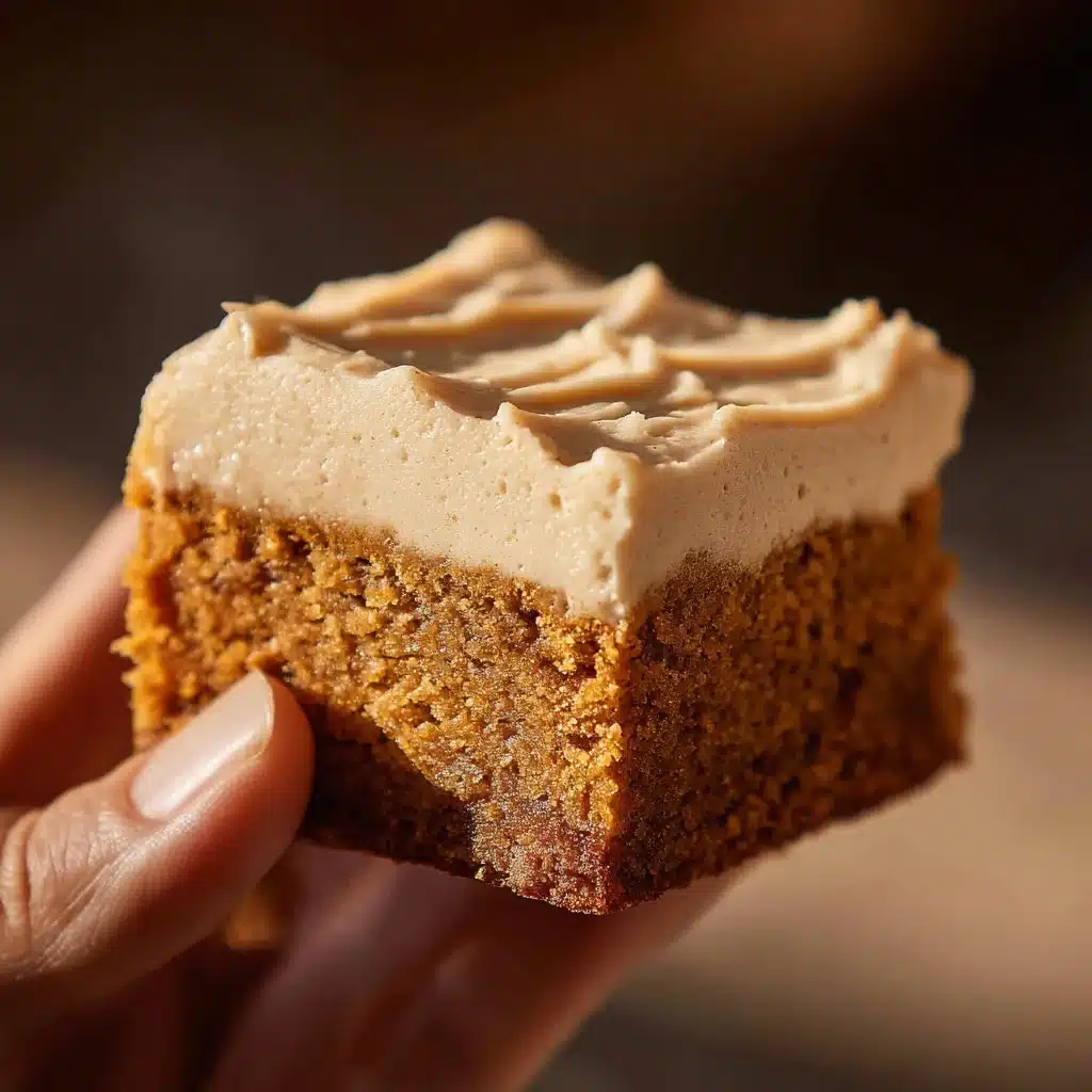 Delicious brownies topped with velvety frosting ready to enjoy.