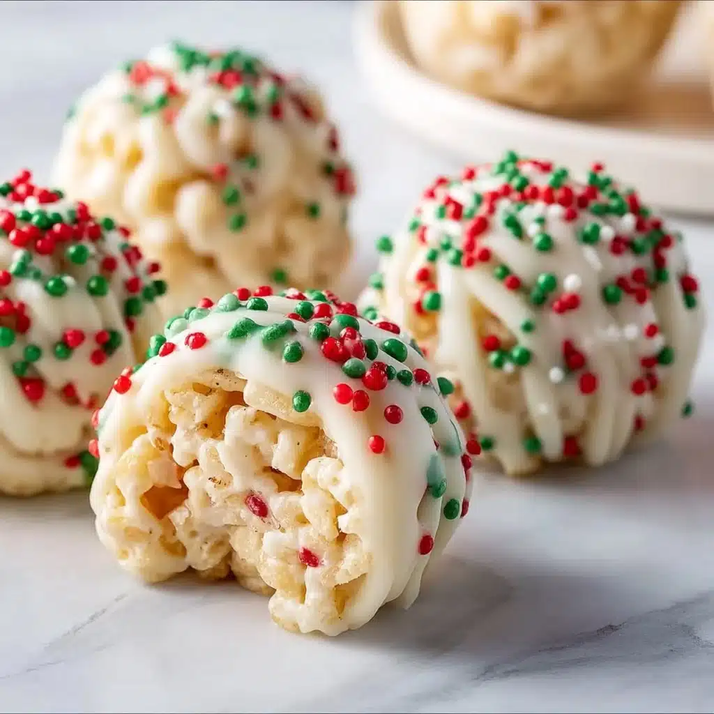 Delicious Christmas Rice Crispy Treats decorated with festive colors and shapes.