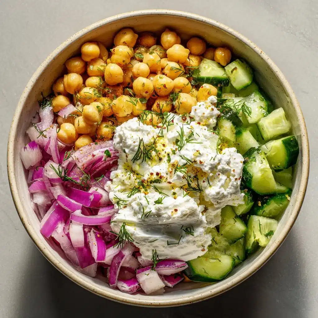 Cottage Cheese and Chickpea Salad served in a bowl, garnished with herbs.