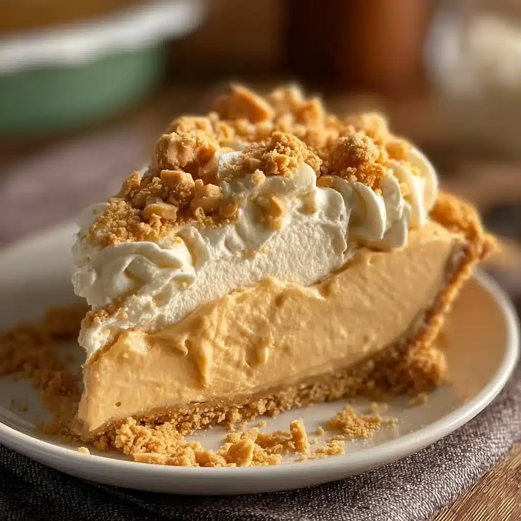 Delicious Amish Peanut Butter Cream Pie served with whipped cream.