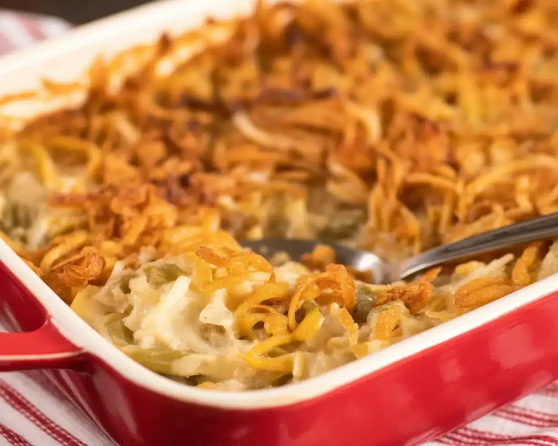 Irresistible Campbells Green Bean Casserole topped with crispy onions, a holiday classic.