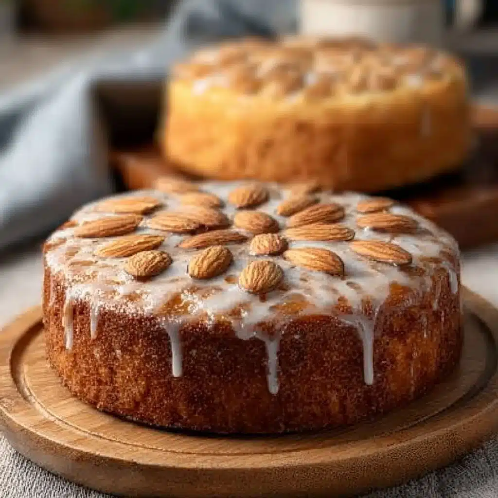 Delicious Honey Almond Cake topped with almonds and drizzled with honey, ready to enjoy.