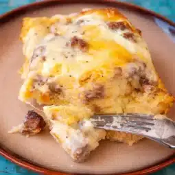 Homemade Biscuits And Gravy Casserole with sausage and fluffy biscuits