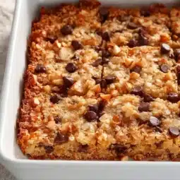 Baked German chocolate cookie bars with chocolate and coconut topping