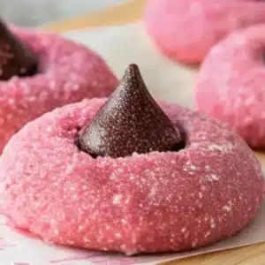 Plate of freshly baked Strawberry Kiss Cookies with chocolate hearts