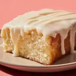 Slice of Traditional Vanilla Mayonnaise Cake on a plate with frosting