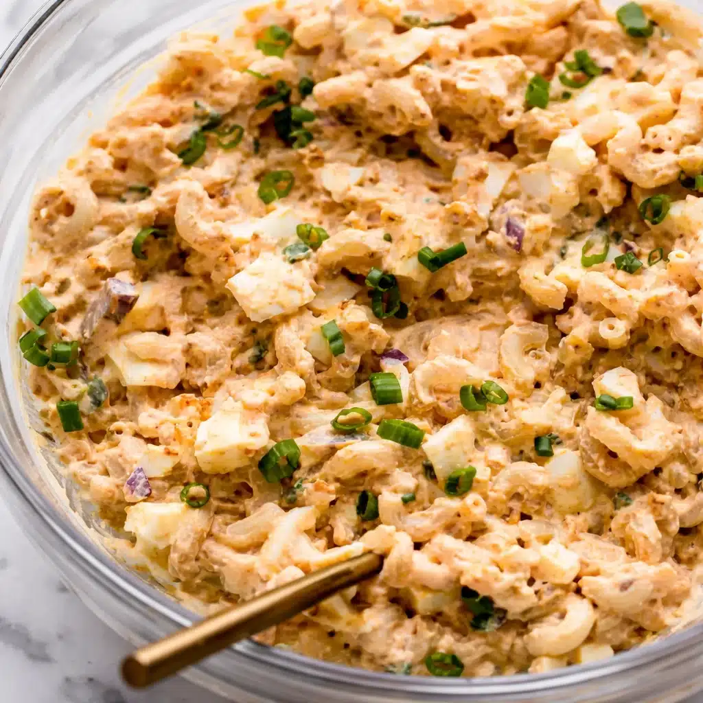 Creamy high protein egg pasta salad with salami and cheese, a healthy meal option.
