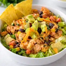 High-Protein Southwest Chicken Salad with grilled chicken and fresh vegetables served in a bowl.