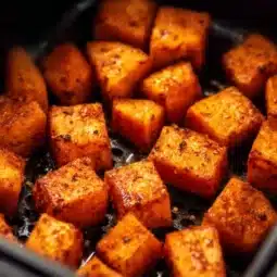 Crispy air fryer sweet potato cubes served in a bowl