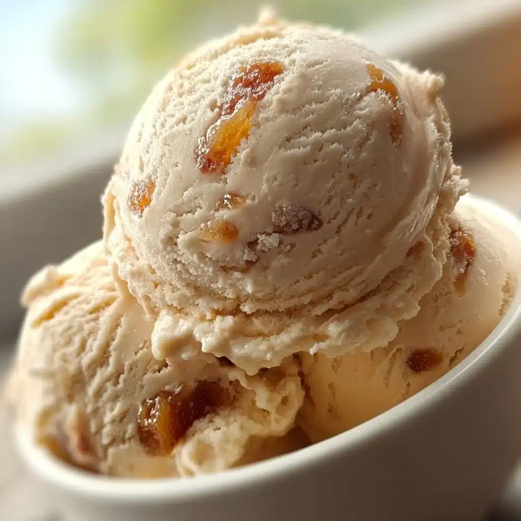 Creamy brown sugar apricot ice cream in a bowl with fresh apricots
