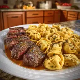 Delicious Garlic Butter Steak Tips served with cheesy mozzarella tortellini