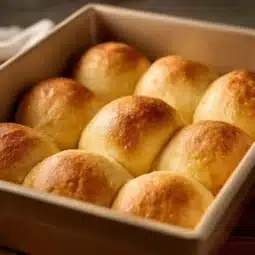 Freshly baked homemade brioche bread loaf on a wooden table