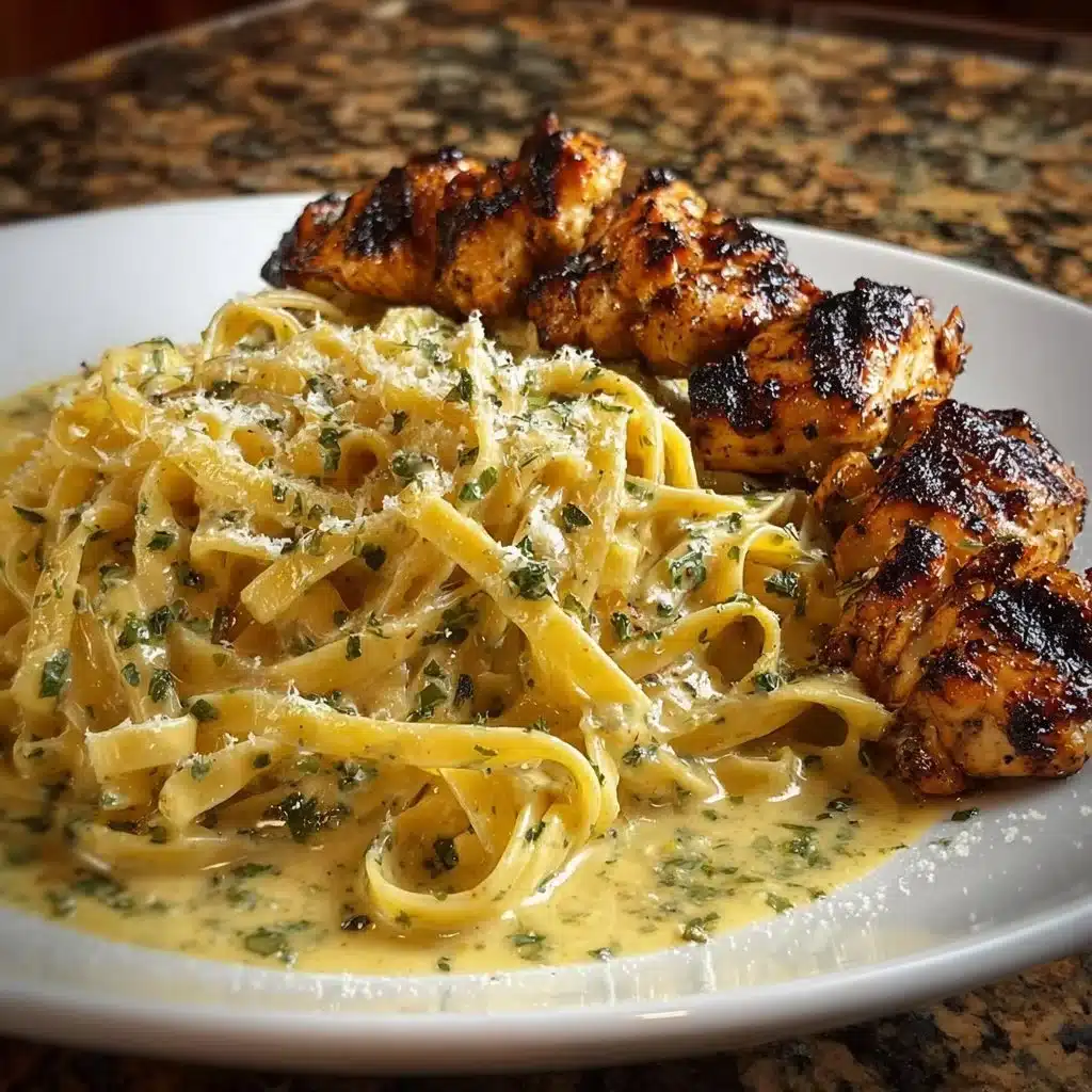 Plate of Lemon Garlic Chicken with Garlic Parmesan Cream Linguine