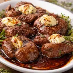 Juicy beef tenderloin medallions cooked in garlic herb brown butter sauce