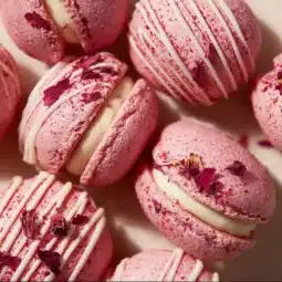 Delicious strawberry macarons on display, showcasing their vibrant pink color