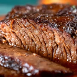 Delicious crockpot brisket cooking with spices and herbs