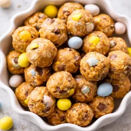 Delicious Cadbury Egg protein balls made with oats, peanut butter, and Mini Eggs.