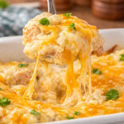 Creamy Angel Chicken Rice Casserole with chicken, rice, and cheese in a savory sauce.