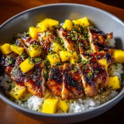 Mango glazed chicken twists with savory Asian flavors on a plate