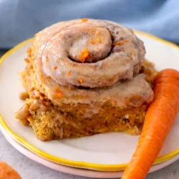Soft Carrot Cake Cinnamon Rolls with cream cheese frosting and shredded carrots