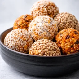 Healthy Carrot Cake Energy Balls made with oats, walnuts, and shredded carrots.