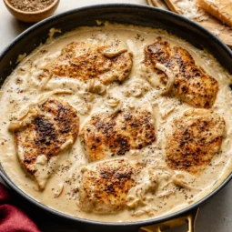 Delicious creamy caramelized onion chicken served with mashed potatoes.