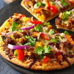 Delicious Vegan Jamaican Jerk Pizza topped with fresh ingredients and spices